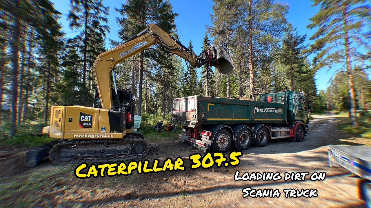 Loading dirt on Scania truck | Caterpillar 307.5