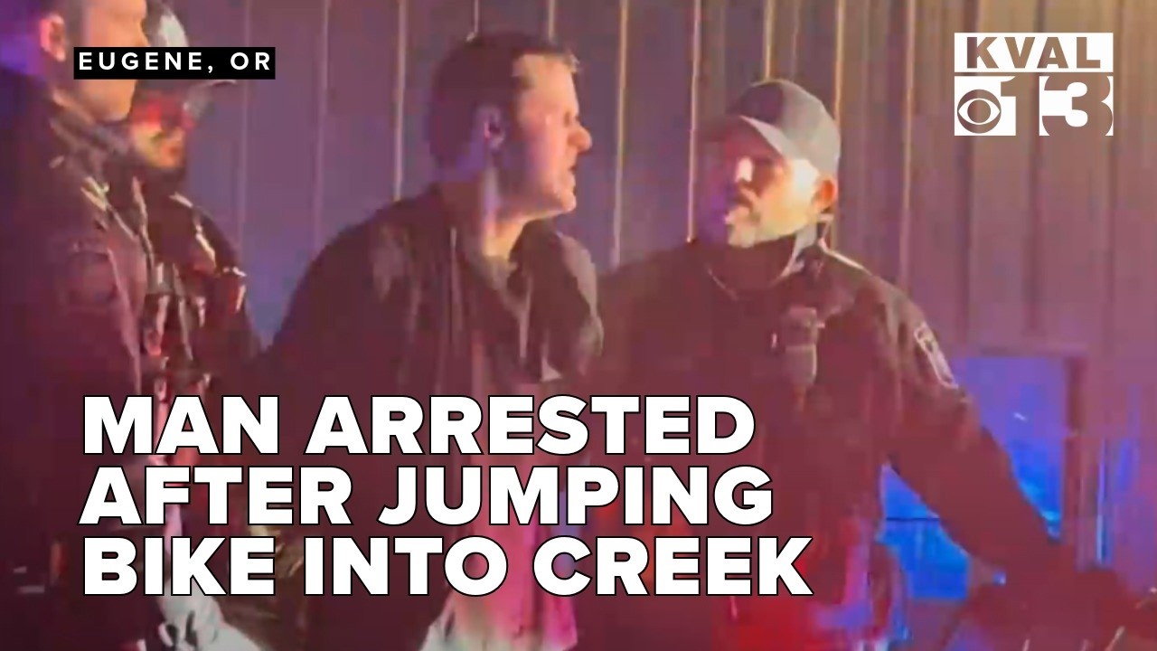 Man arrested after jumping bike into creek