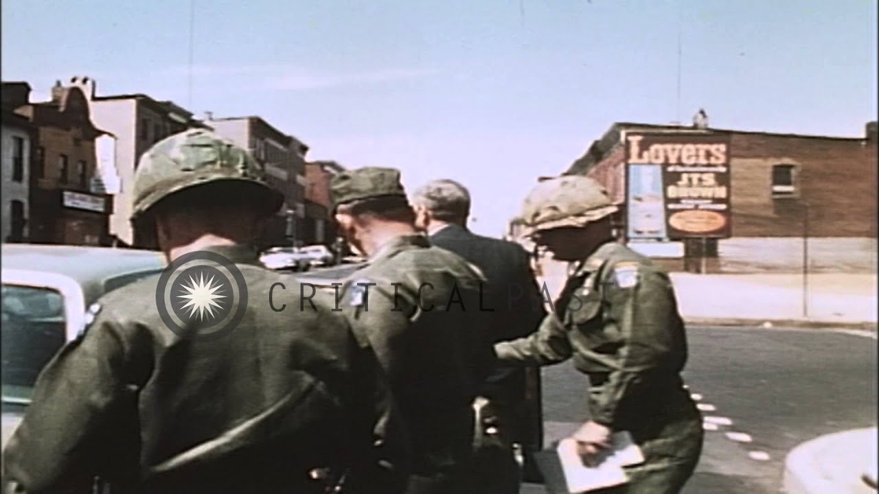 A soldier and an official inspect and talk after the Baltimore Riots in Baltimore...HD Stock Footage