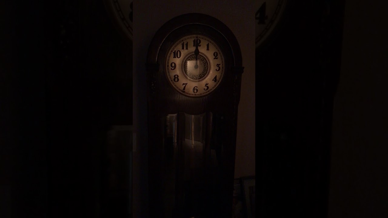 Grandfather clock strikes 12