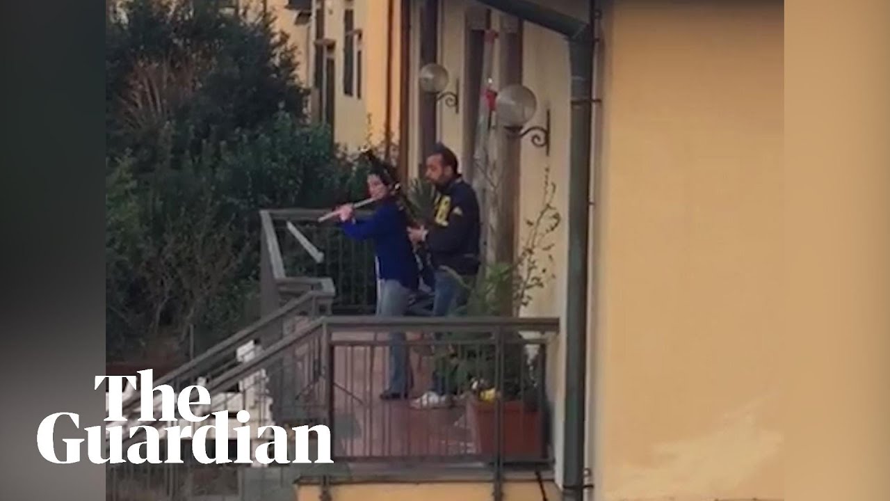 Coronavirus: neighbours play instruments from balconies as Italy stays under lockdown