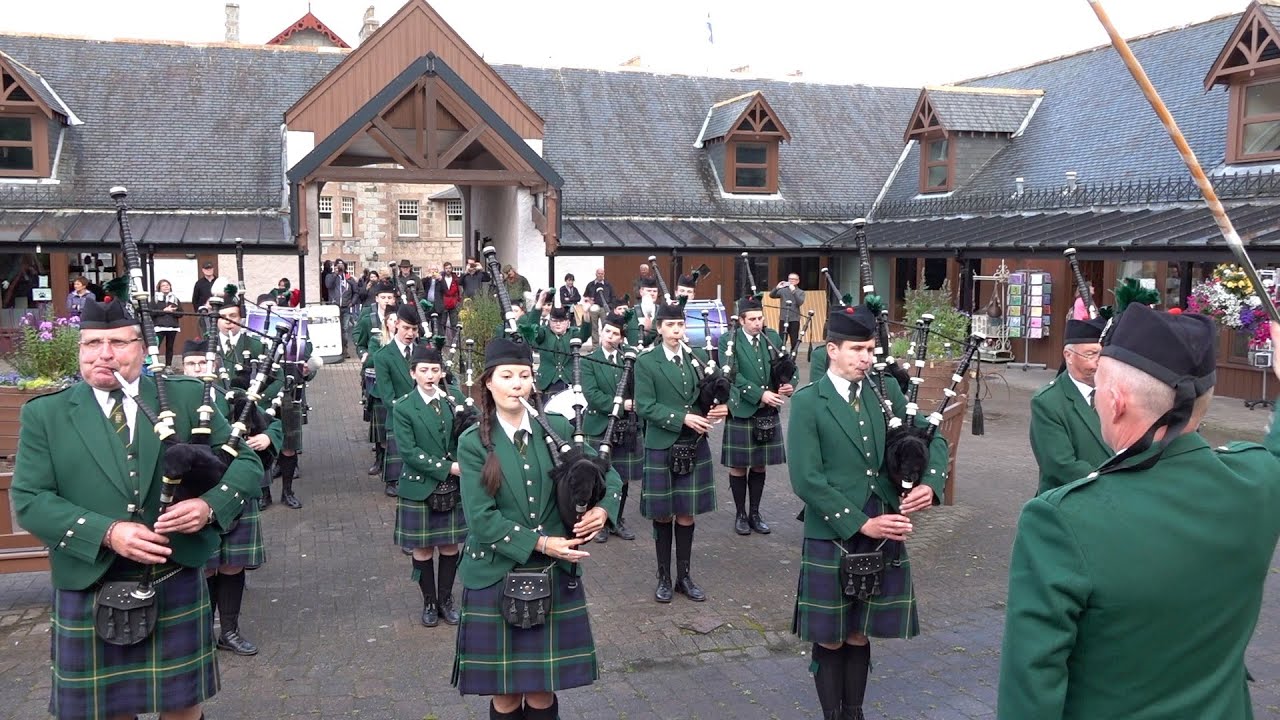 Huntly Pipe Band march off playing 