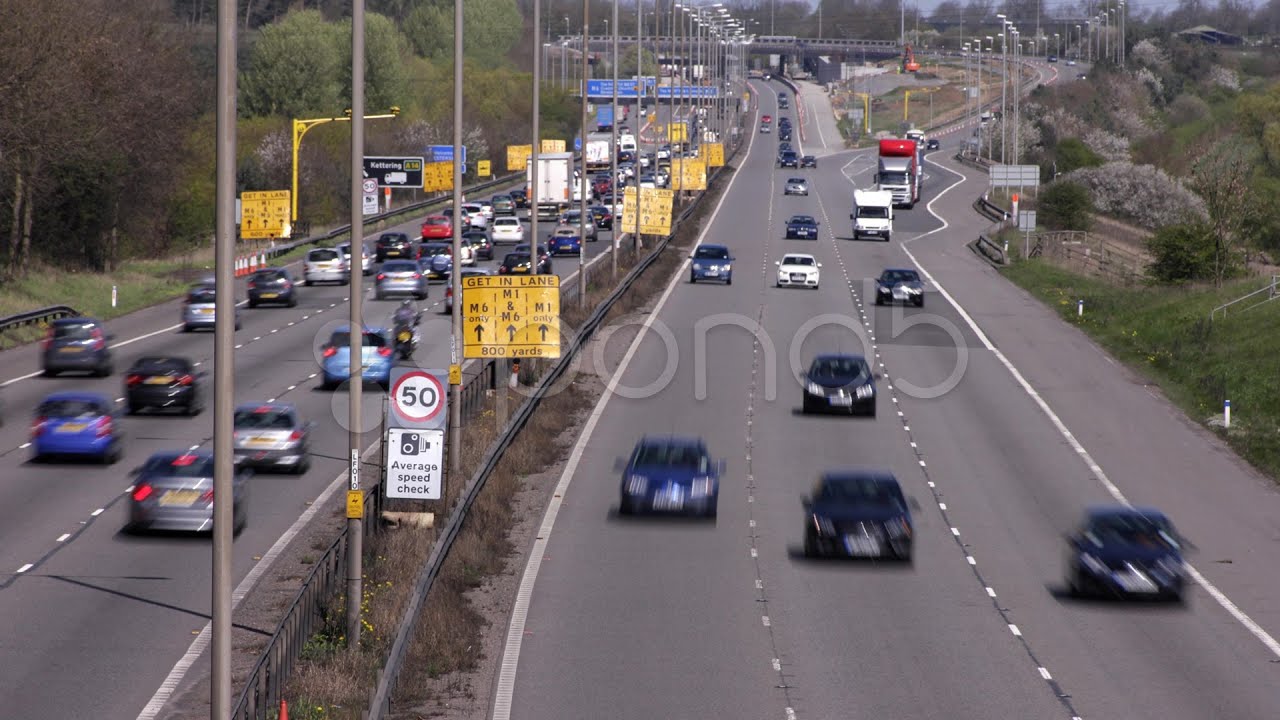 Traffic on the M1-M6 Motorway junction dual carriageway. Time lapse.. Stock Footage