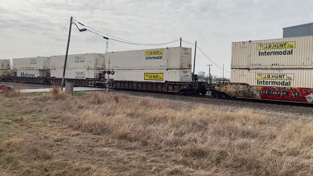 BNSF 7187 leads the Q-ALTPTL at Rhome, TX 