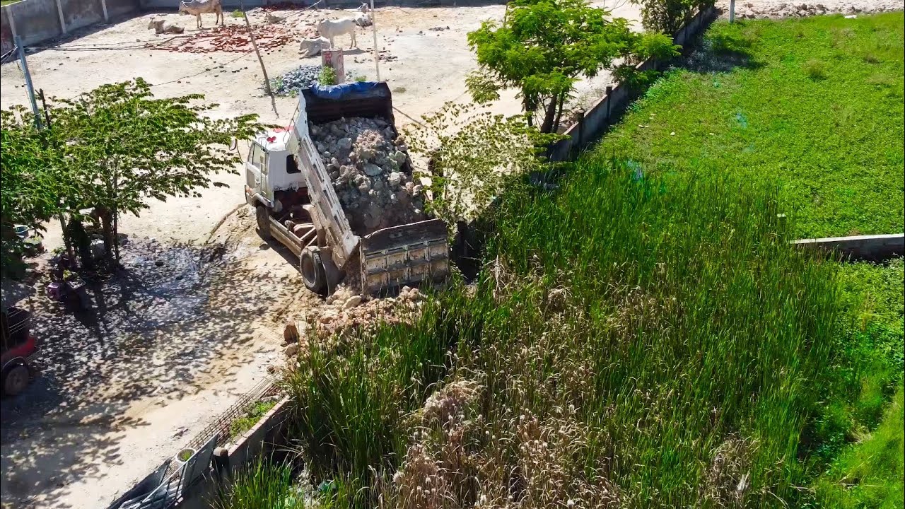 First Start opening new Project Land fill up by Bulldozer Komatsu d20p with DumpTruck