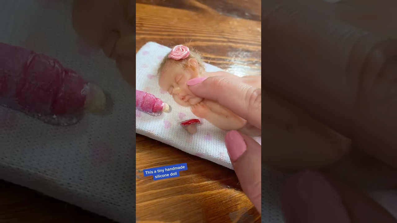 Squishing Tiny Silicone Baby Doll