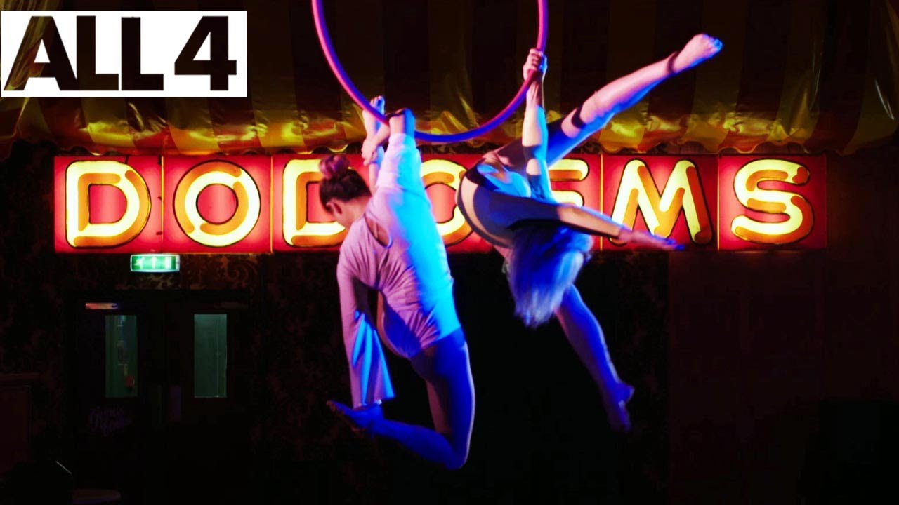 Aerial Duo Suspended by Ring in Daring Circus Act | Circus Girls