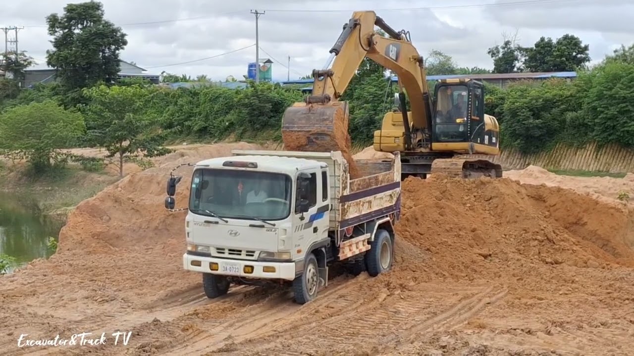 Excavator and dump truck are working smoothly.