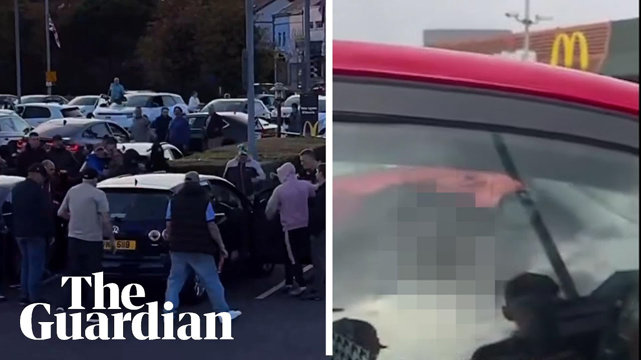 Footage shows men attacking cars and shouting racist abuse in Belfast