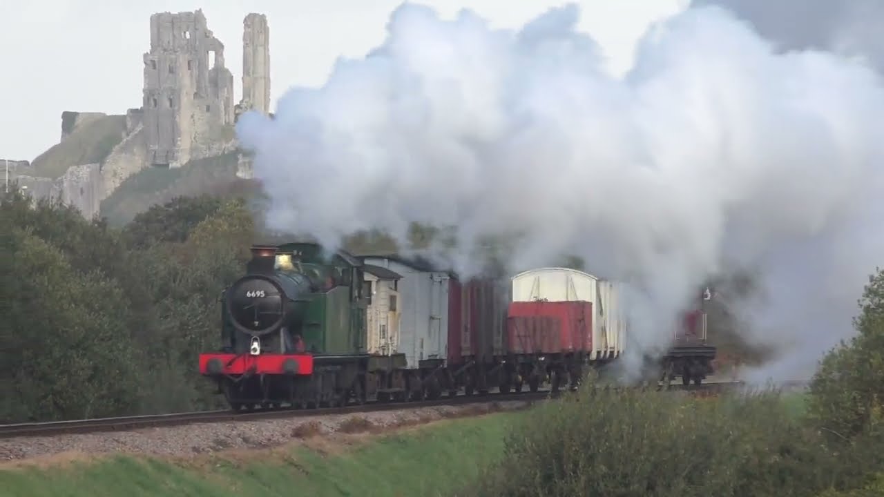 GWR '5600' Class 0-6-2T No. 6695 passes a CASTLE!  (Corfe Castle, Swanage Railway!)