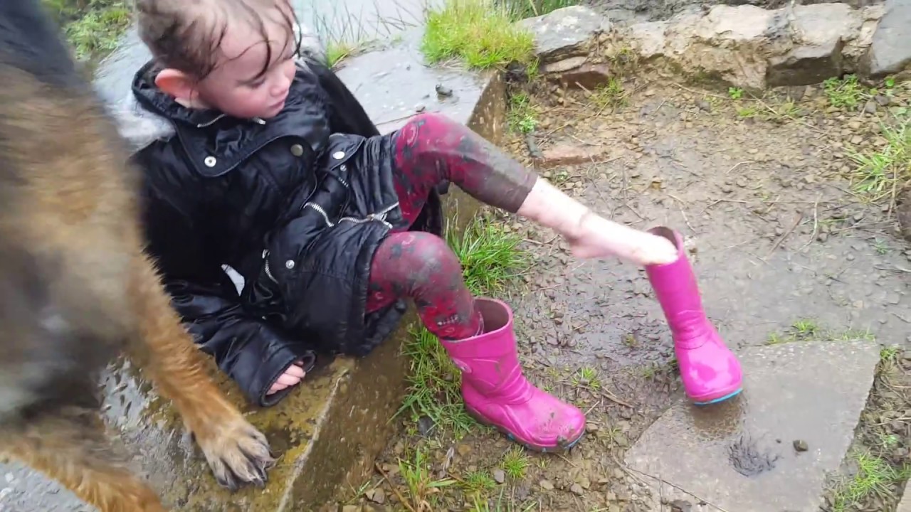 Little girl gets stuck in the mud