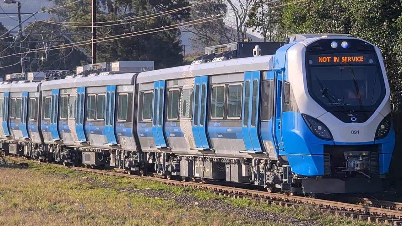 PRASA's X-Trapolis EMU Metro trainset pulling up to the departure signal at Lions River station.