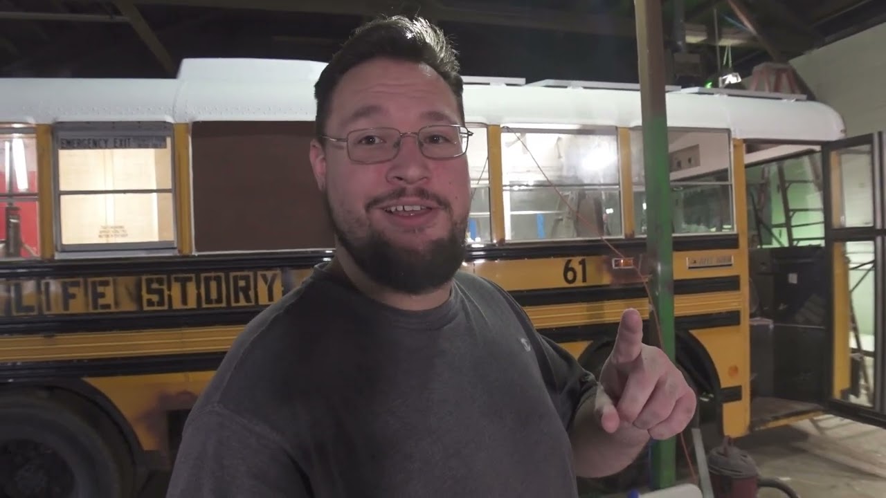 lets cut some holes in this bus!! water heater, understorage, and solar