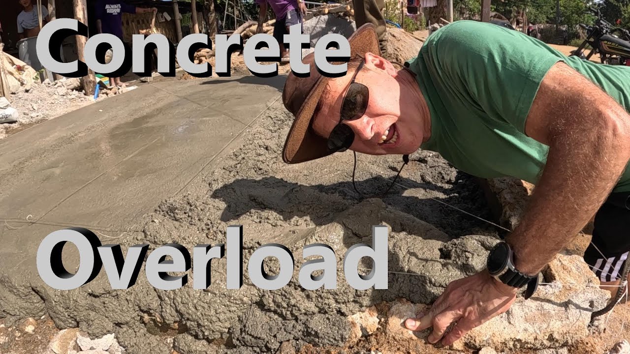 Luke Damant's dad uses half a ton of cement to build a concrete slab at a remote Filipino village