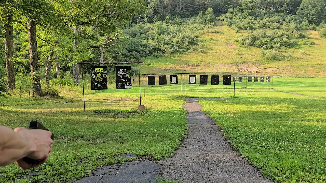 10 yards minimum on 12 inch plate with a Glock 19.