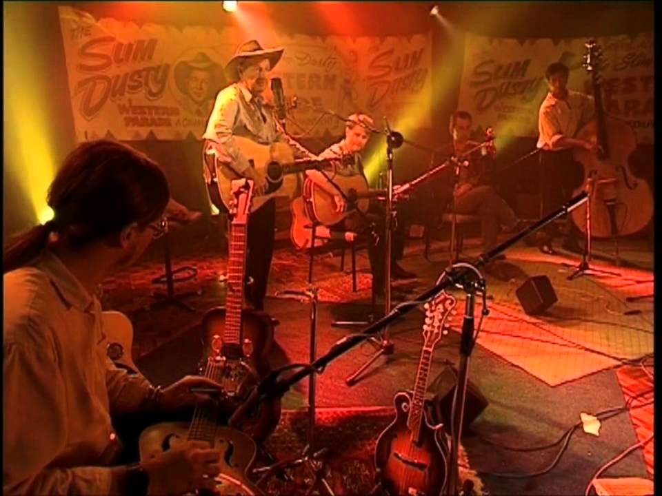 When the Rain Tumbles Down in July ---  Slim Dusty
