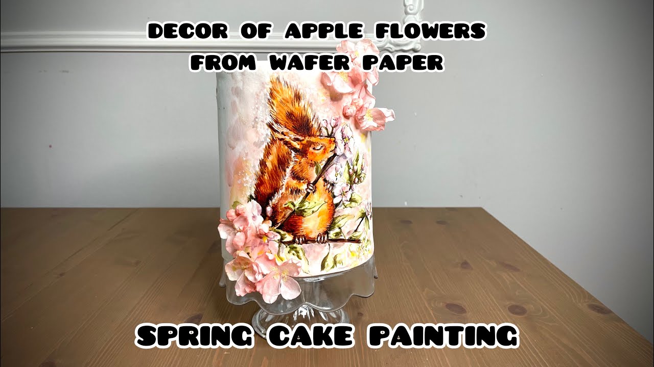 Spring cake painting .Decor of apple flowers from wafer paper