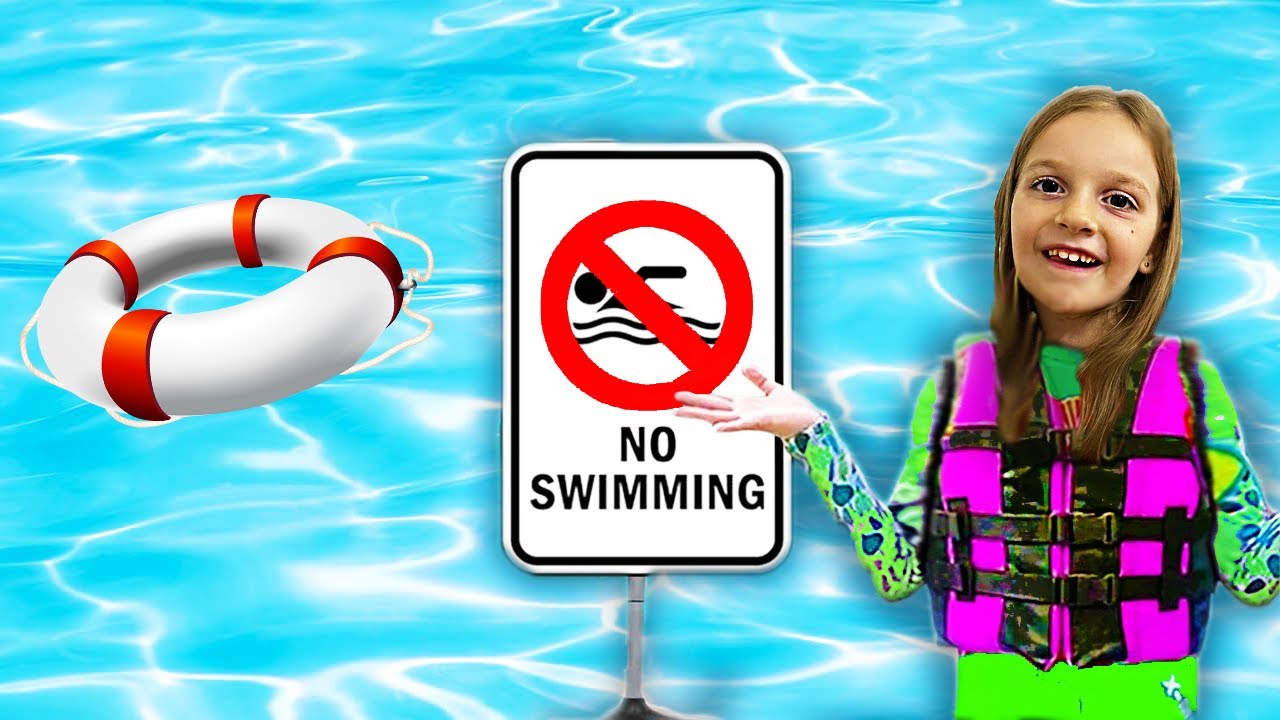Sara shows the safety rules in the pool