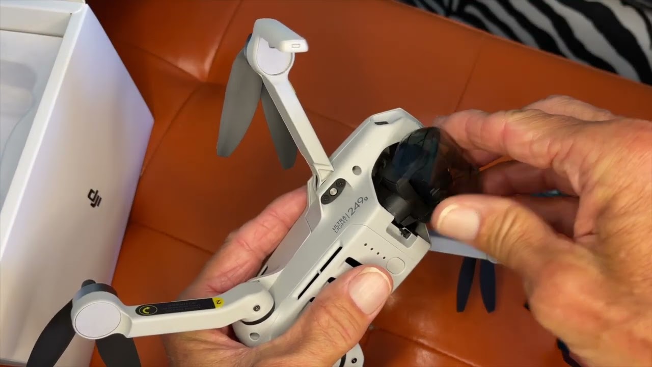 How to remove and reattach the gimbal cover on a dji mini 2 drone