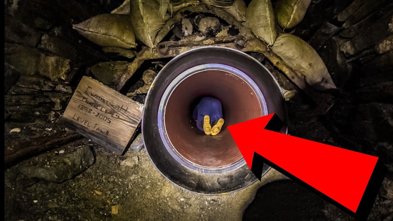 CRAWLING THROUGH A PIPE INTO THE UNKNOWN (Cwmystwyth mine)