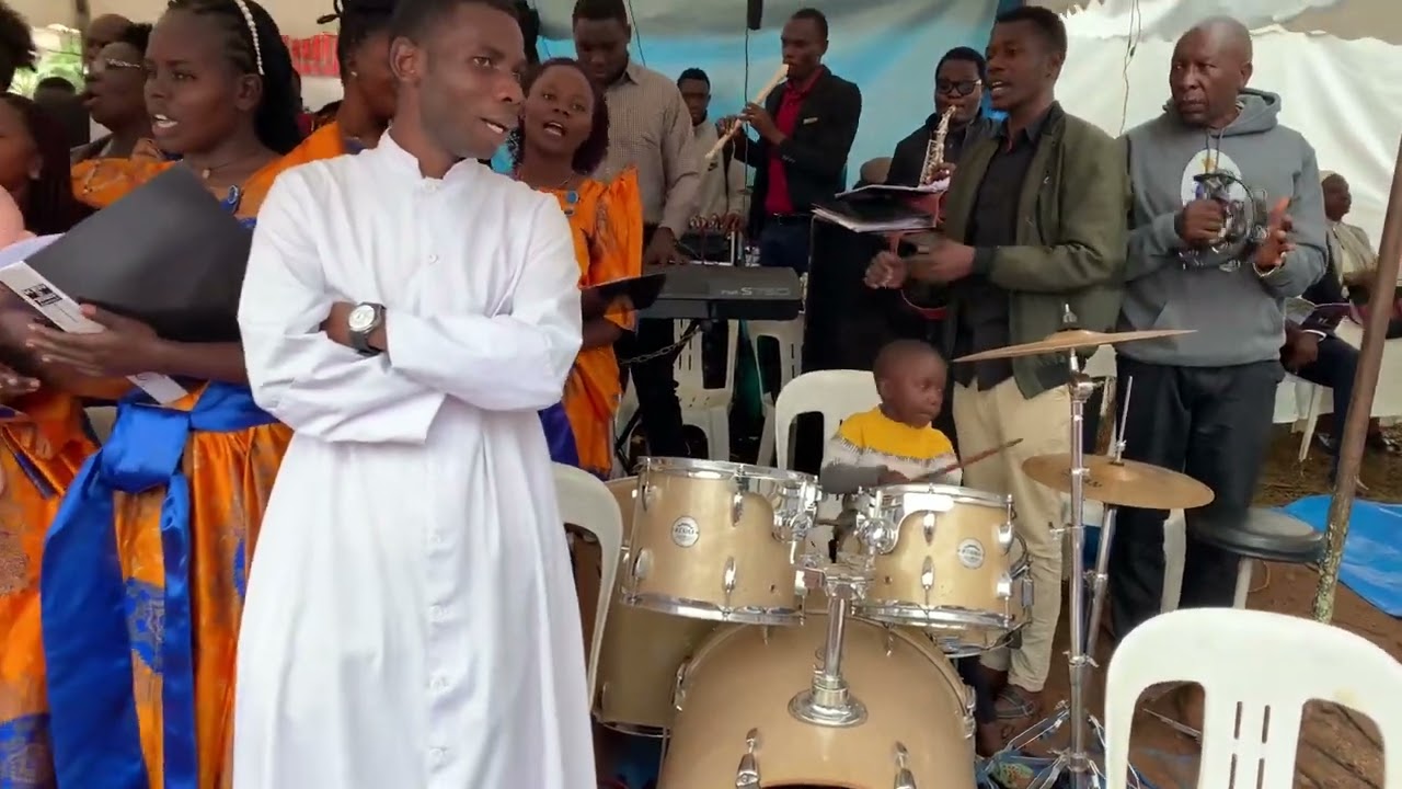 Five year old Fabian Lwanga  playing jazz drums in holy mass
