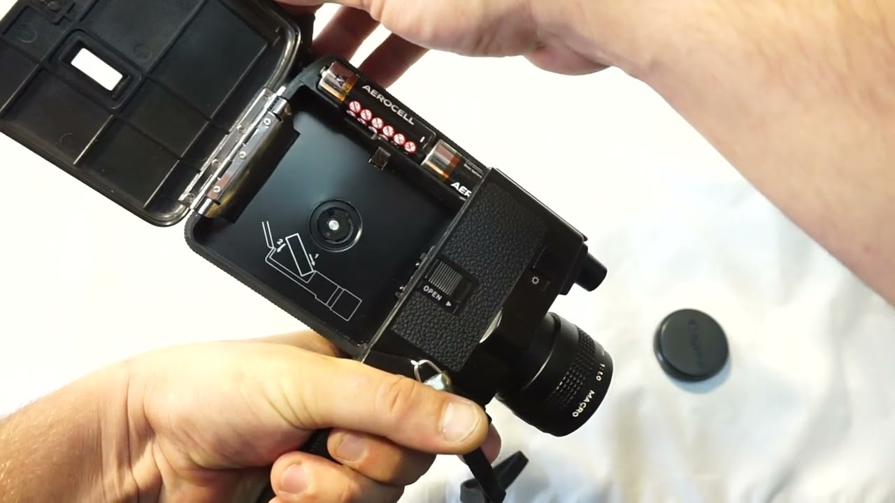 Canon 310 XL loading Super 8 film and batteries on Super 8 camera Canon 310 XL FILM TESTED + ON SALE