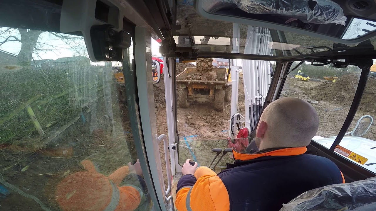 Takeuchi excavator digging out a footing.