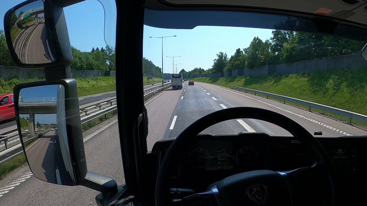 Truck & Trailer driving on Motorway to Västerås, Scania p450