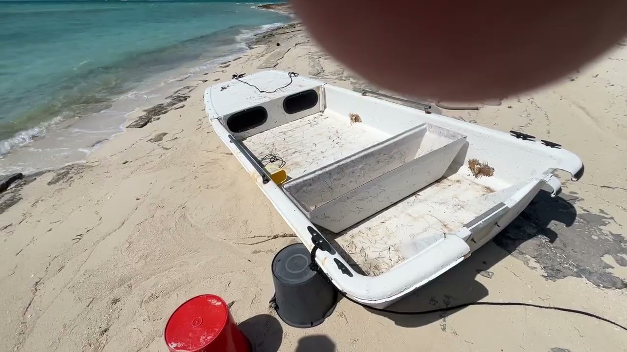 Our boat washed up on shore after storm!! #offgridliving #bahamaslife #boats