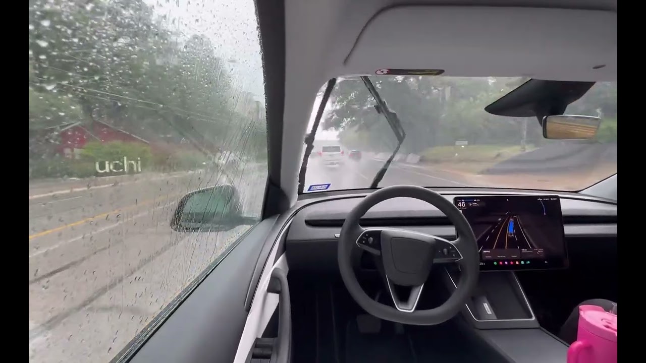 Tesla Robo Taxi Driving In The Rain Witn No Driver