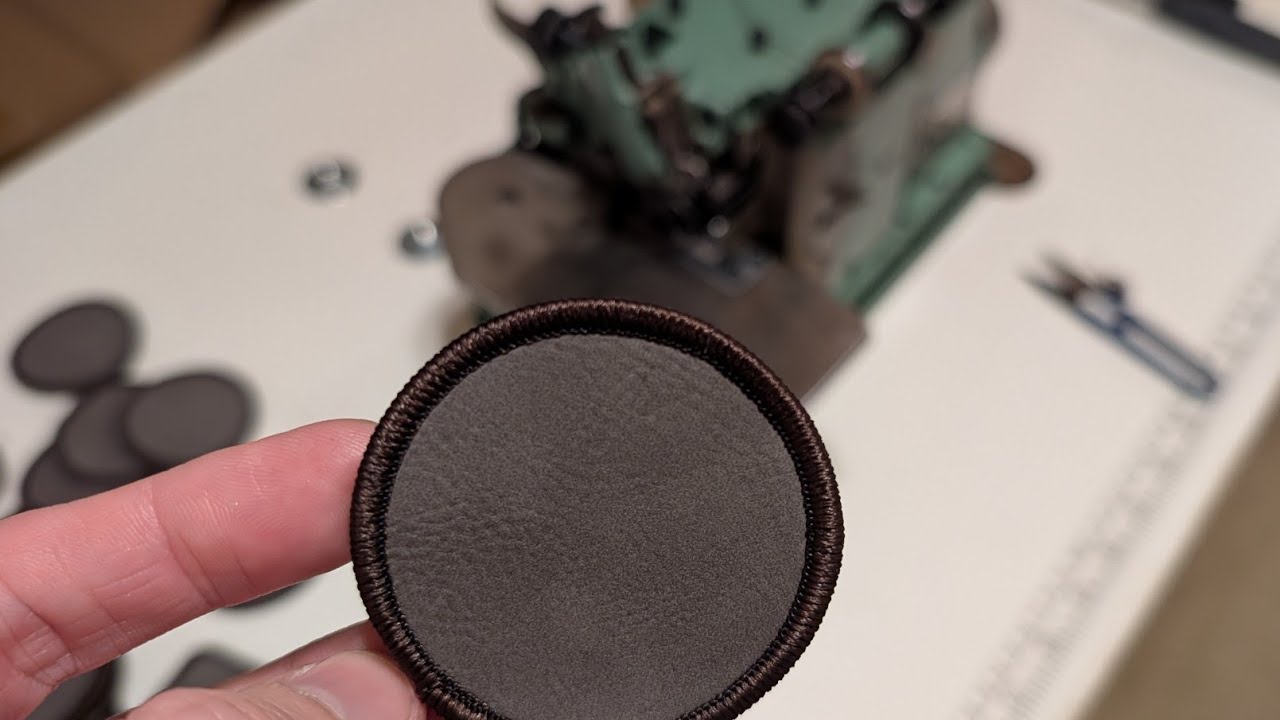 Learning our new Merrow machine for sewing custom twill patches