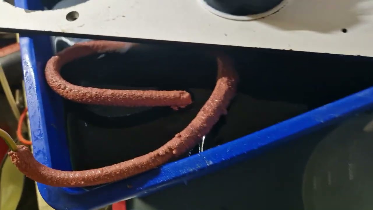 Copper sulfate refining cell. New anode bag setup with slime siphon. 
