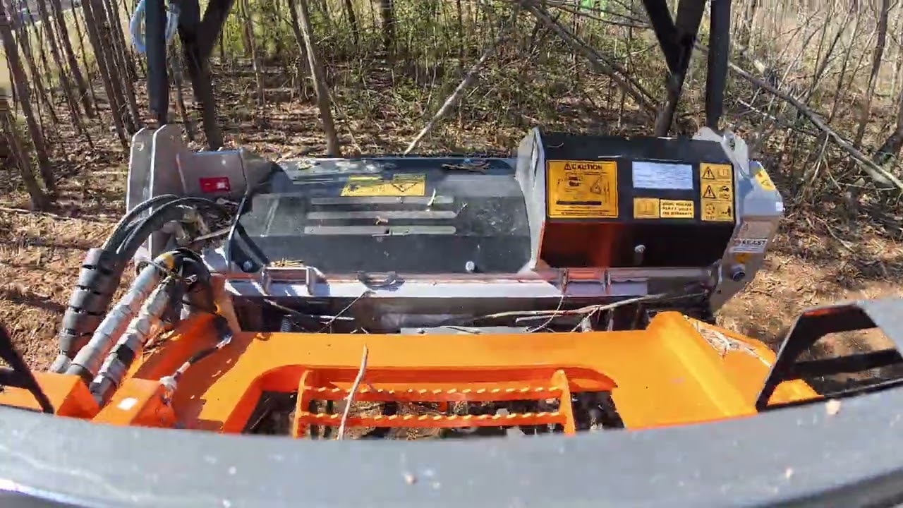Develon DTL35 skid steer with FAE BL4 SSL 150 mulching attachment with bite limiter.  #Develon #FAE