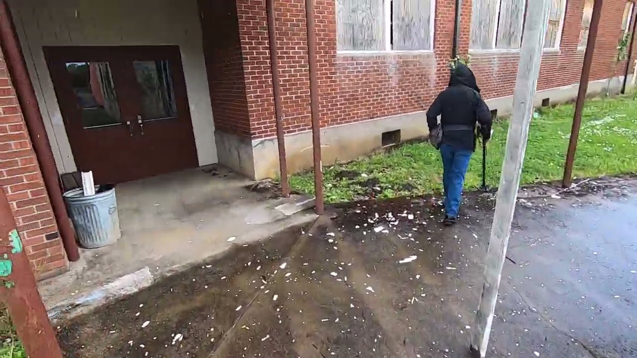Metal detecting behind the sketchy abandoned high school.
