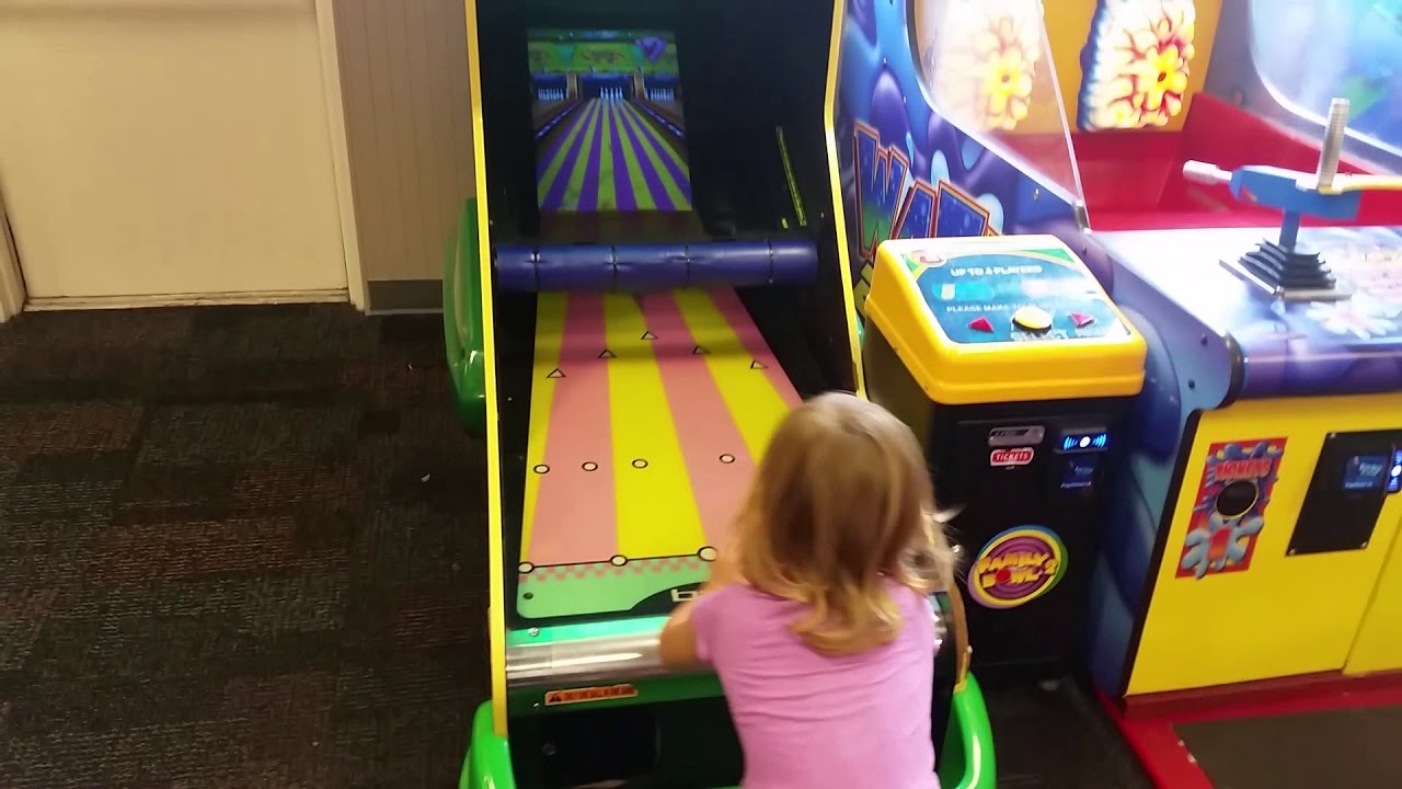 Ellie bowling at Chuck E Cheese