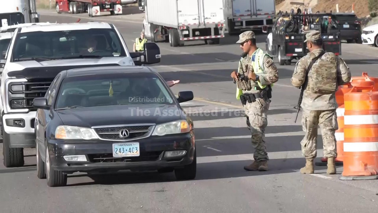 National Guard work at roadblock outside wildfire zone in Reno, Nevada