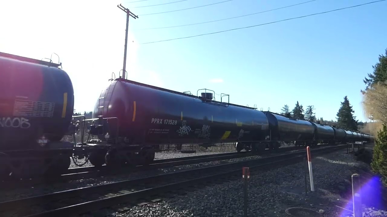 (Northbound) BNSF Loaded Oil Train passes through the Stewart Ave Railroad Crossing.