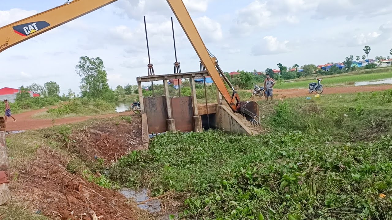Excavator Remove Floating Plants Clogged Drain