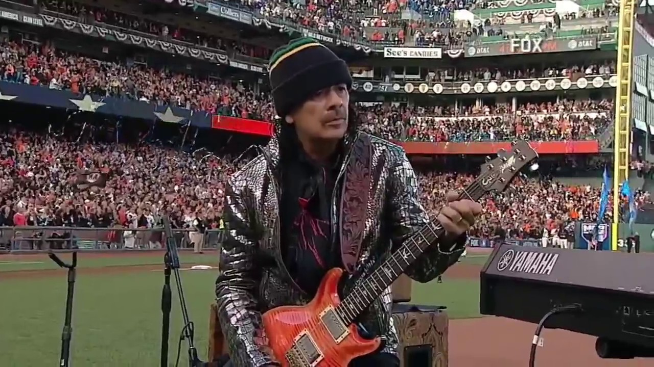 WS2014 Gm4: Carlos Santana and his son, Salvador, perform the national anthem