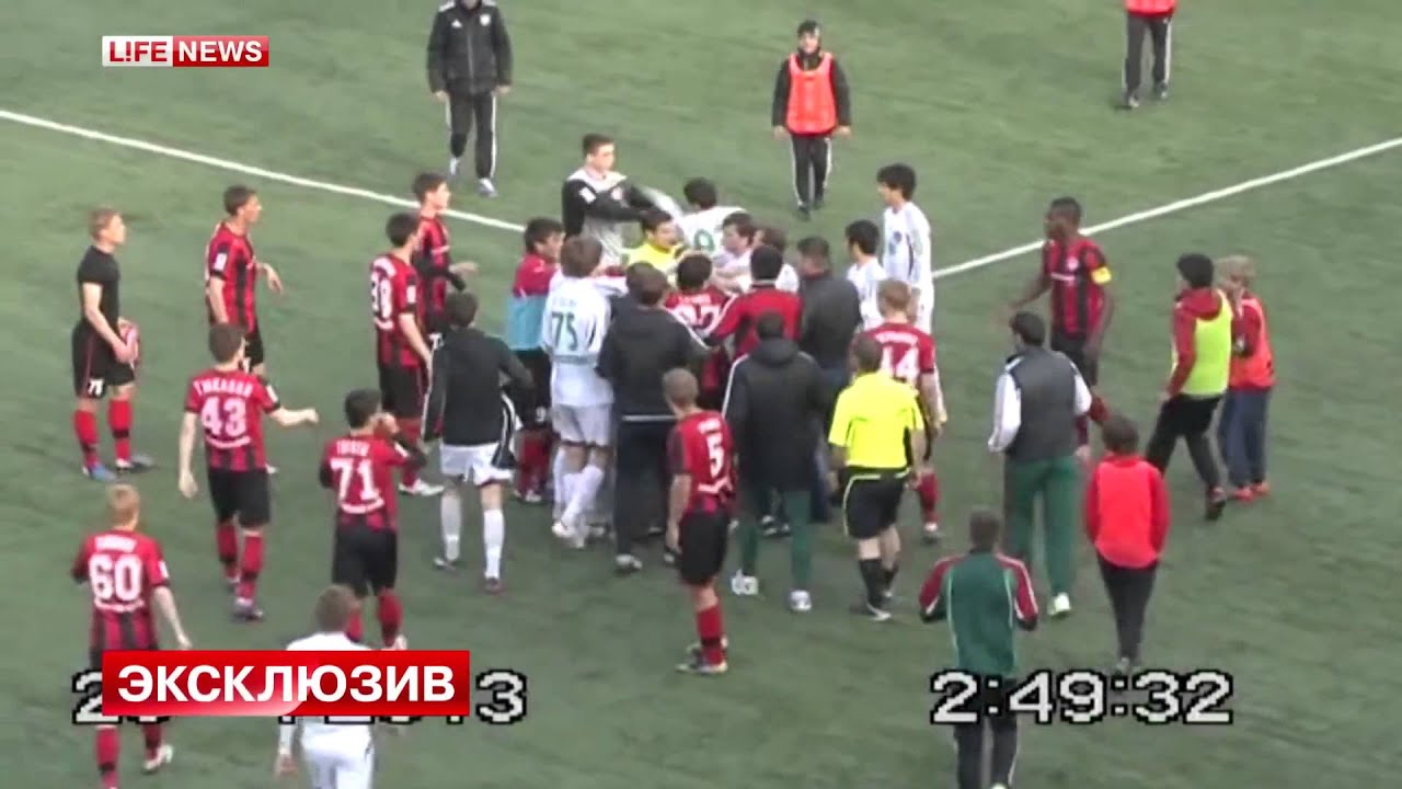 INSANE A Russian linesman punches and kicks a youth football player in the head