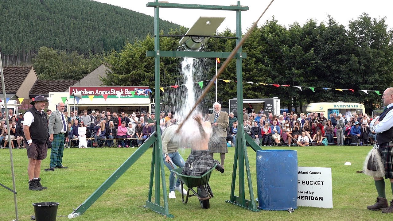 Tilt The Bucket open challenge during the 2019 Ballater Highland Games in Aberdeenshire Scotland