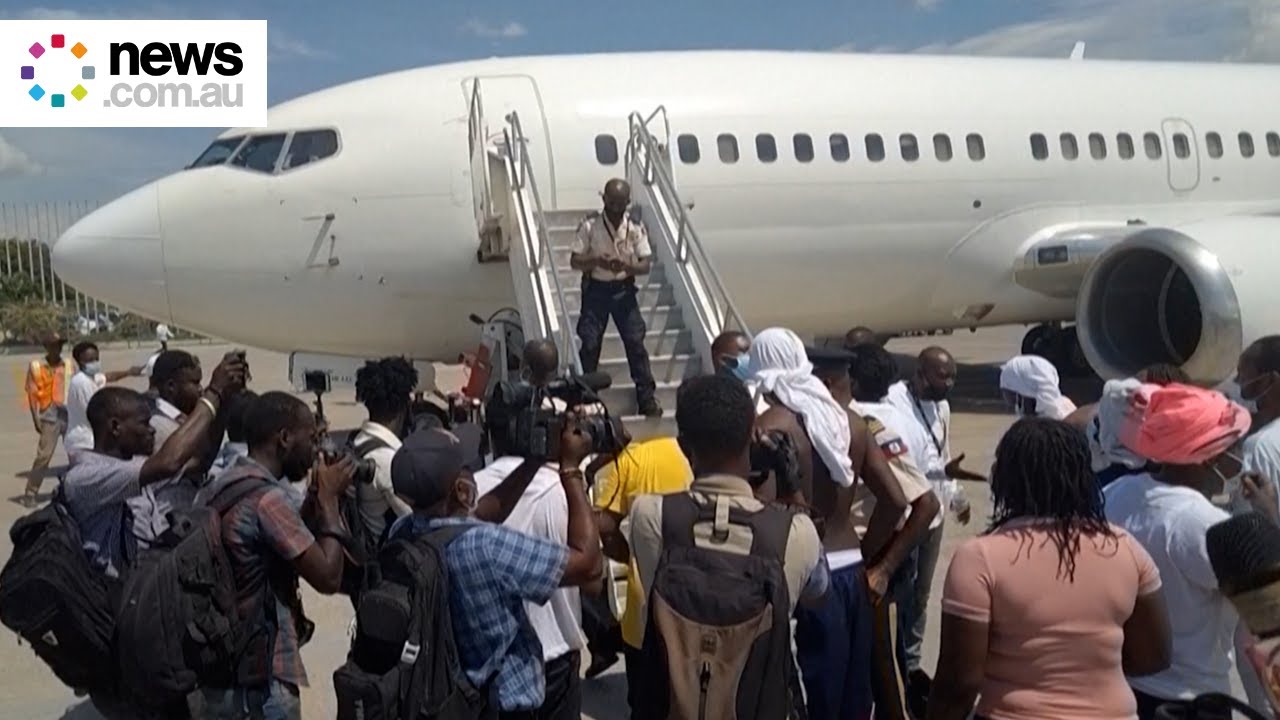 Anger at Haitian airport as deported migrants arrive home