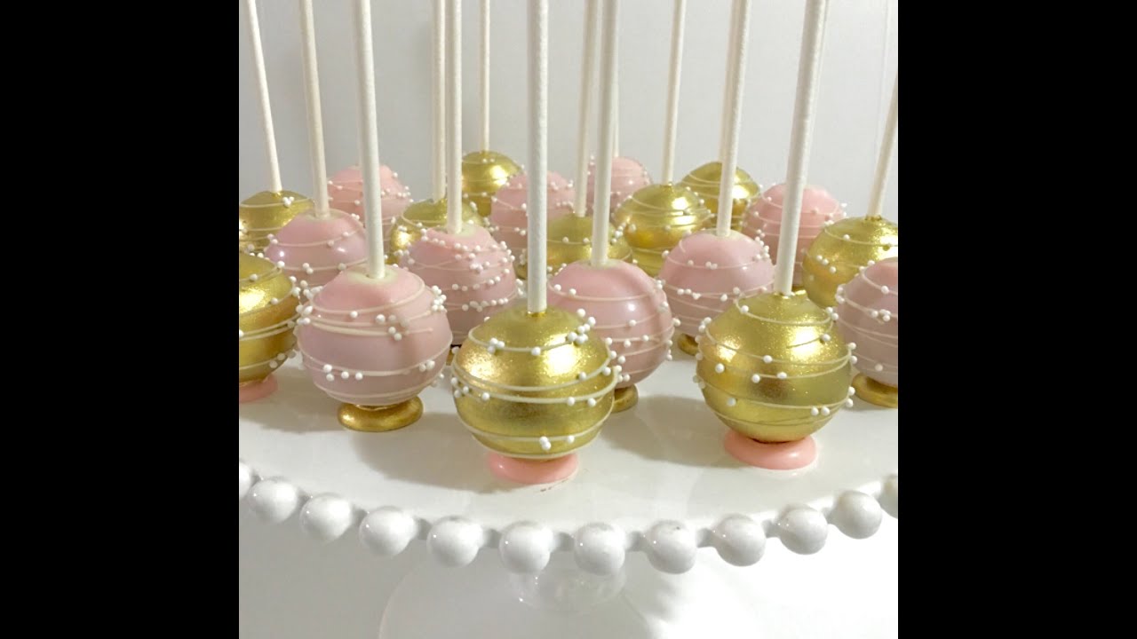 Upside down pink & gold Cakepops with flat bottom base and stripes/swirls design