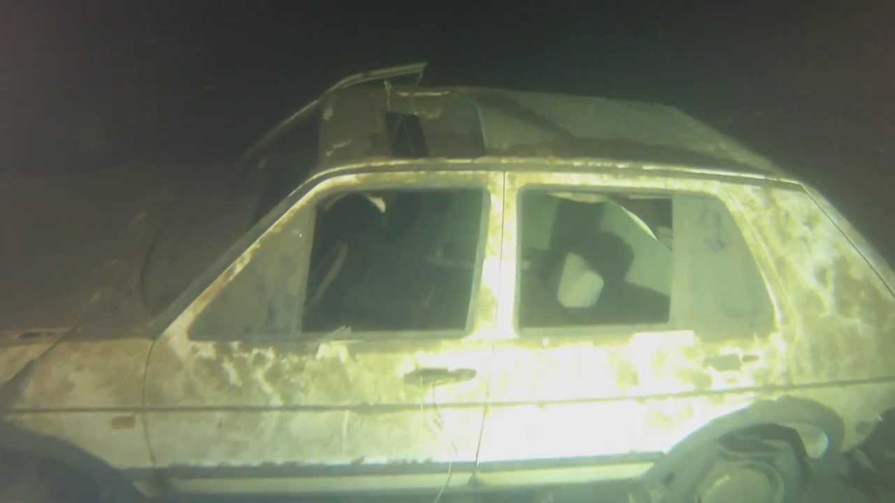 wrecked car under waters of lake como