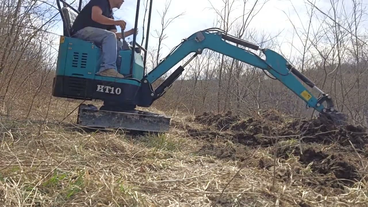 Using my Chinese mini excavator RE building a swale pt. 2