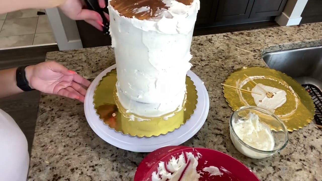 Stacking and decorating a double barrel cake.