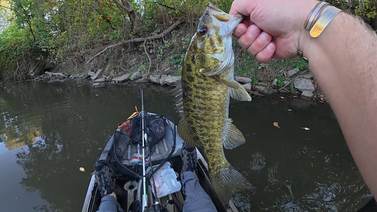 Kayak Fishing a rural farm town creek during low water.