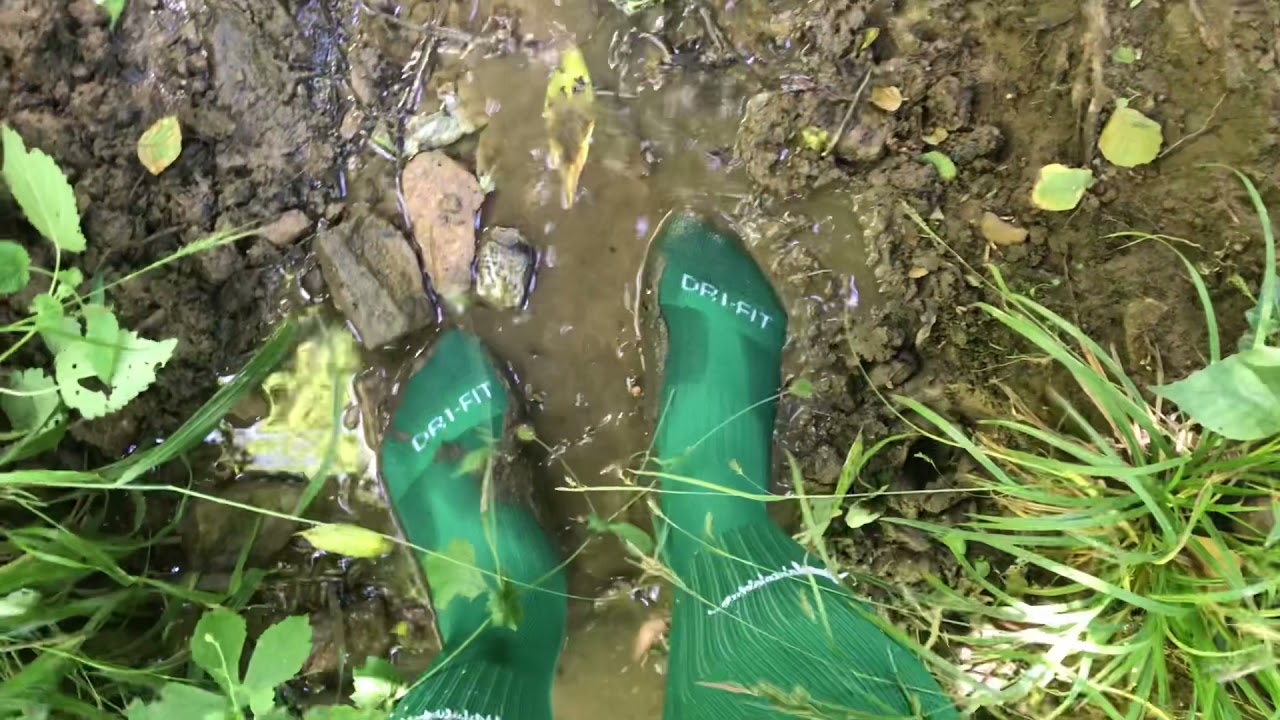 Muddy green soccer socks