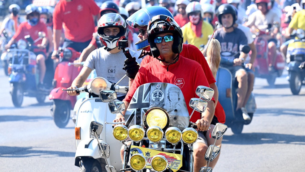 Vespa enthusiasts celebrate iconic scooter's 80th anniversary in Rome
