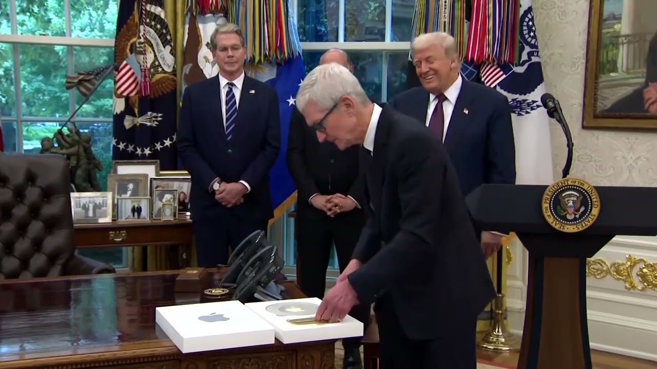 Apple CEO Tim Cook gifts Trump a plaque with a 24-karat gold base | REUTERS